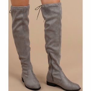 Grey boots. Above the knee